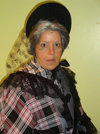 a woman wearing a victorian costume