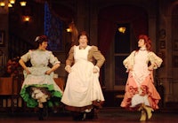 a group of women dancing on a stage