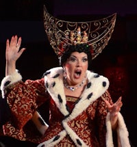 a woman in a costume with a crown on her head