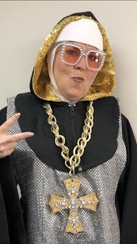 a woman in a nun costume posing for a photo