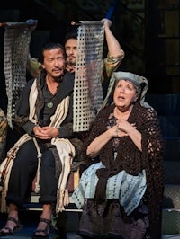 a group of people sitting on a stage